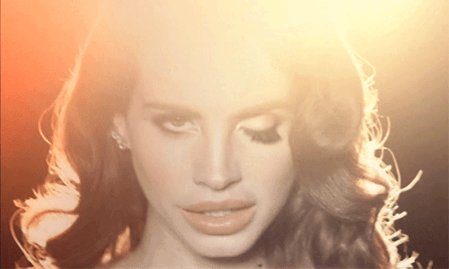 animated gif of Lana Del Rey's eyes blinking out of sync, over and over.