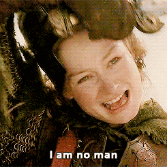 An animated gif of Eowyn from Lord of The Rings taking off her helmet and saying, "I am no man."