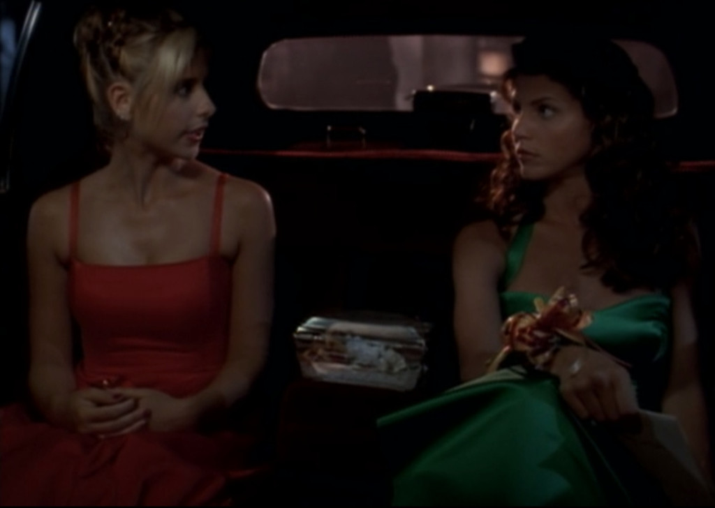 Buffy and Cordelia in their formal dresses, glaring at each other in the back of the limo.