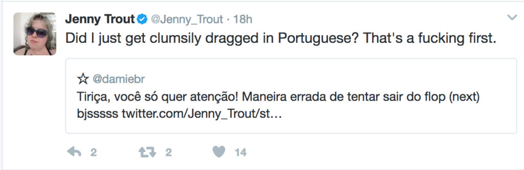 A quoted tweet: "Tiriça, você só quer atenção! Maneira errada de tentar sair do flop (next) bjssss" and my reply, "Did I just get clumsily dragged in Portuguese? That's a fucking first."