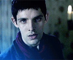 Colin Morgan as Merlin, dramatically fainting.