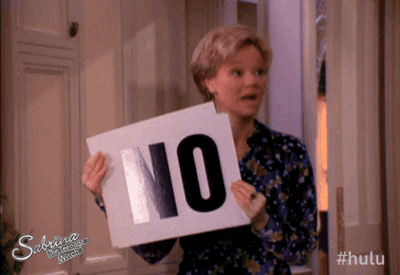 Sabrina The Teenage Witch's Aunt Hilda, holding up and dropping cue cards that read NO.