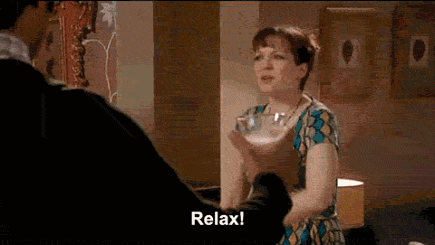 A gif of a scene from The IT Crowd, in which Jen tells Moss, Roy, and Richmond to "Relax!" at a dinner party and they strike ridiculous, stilted poses.