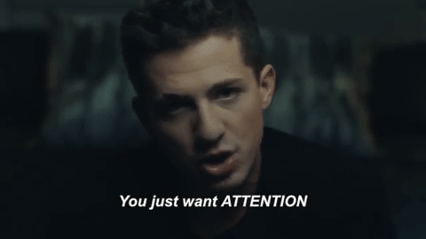 Charlie Puth from his music video, singing the "You just want attention."