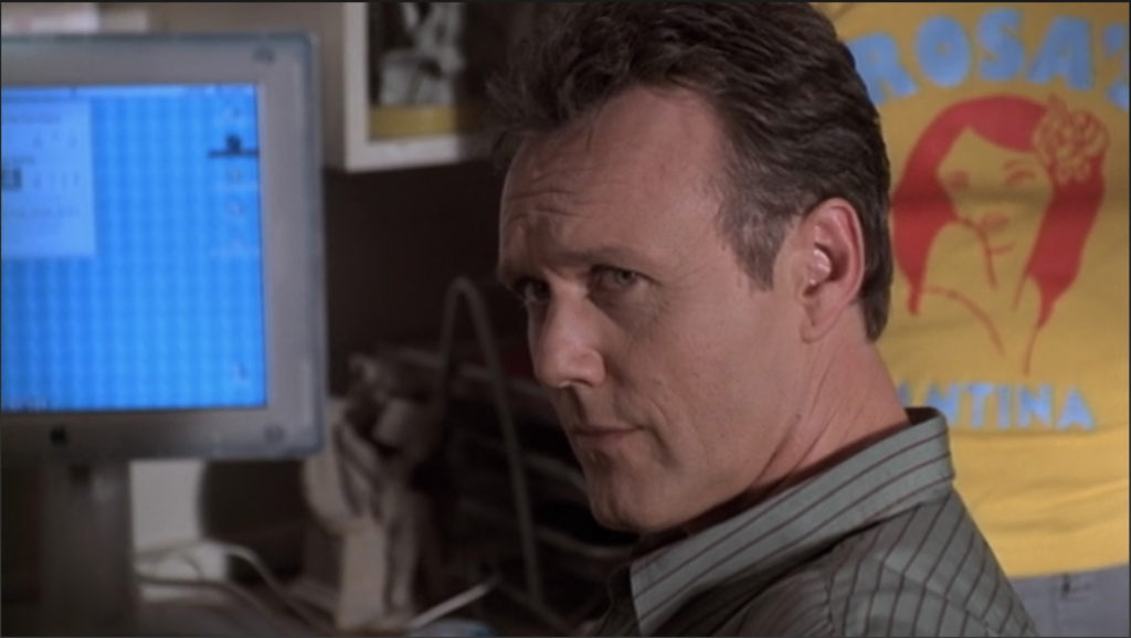 Giles is looking at Buffy with an expression that says plainly "I do not believe a word you are saying an you are digging your own grave at this point."