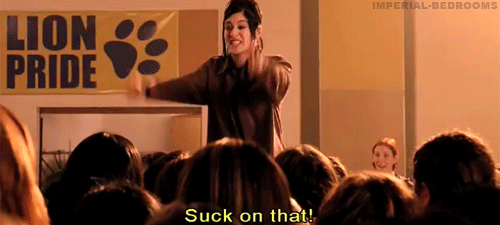 Janis Ian from mean girls, extending two middle fingers and yelling, "Suck on that!"