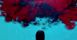 Pool water filling with blood, the words "IT FOLLOWS" appearing in the blood.